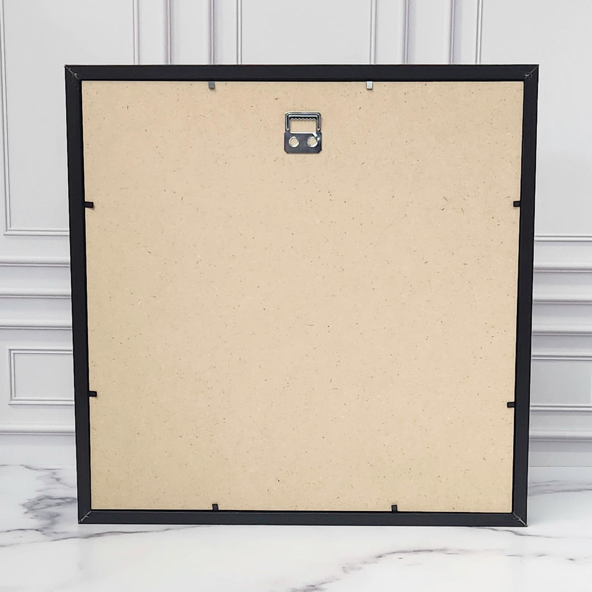 Back of the shadow box frame with the hanging hardware