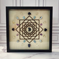 Lunar Energy for Inner Intuition crystal grid in a black glass-front shadow box, front view