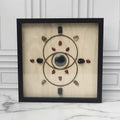 Protection crystal grid in a black glass-front shadow box, front view