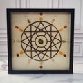Solar Energy for Happiness crystal grid in a black glass-front shadow box, front view